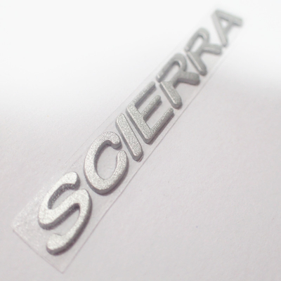 Label Pakaian Perpindahan Panas Silikon 3D Disesuaikan Dengan Warna Silver Shinny